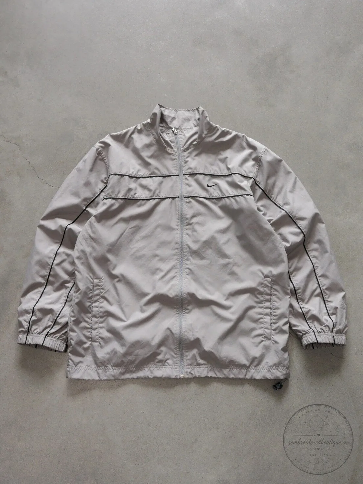 Vintage Nike Beige Windbreaker Jacket with Black Stripes and Swoosh Logo