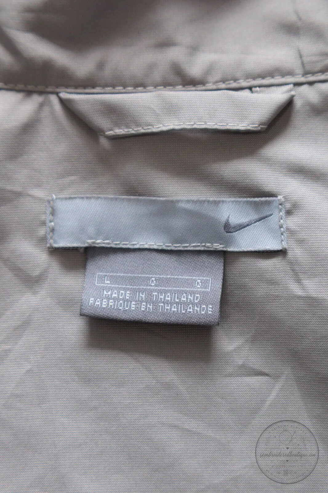 Vintage Nike Beige Windbreaker Jacket with Black Stripes and Swoosh Logo 15 Vintage Nike Beige Windbreaker Jacket with Black Stripes and Swoosh Logo