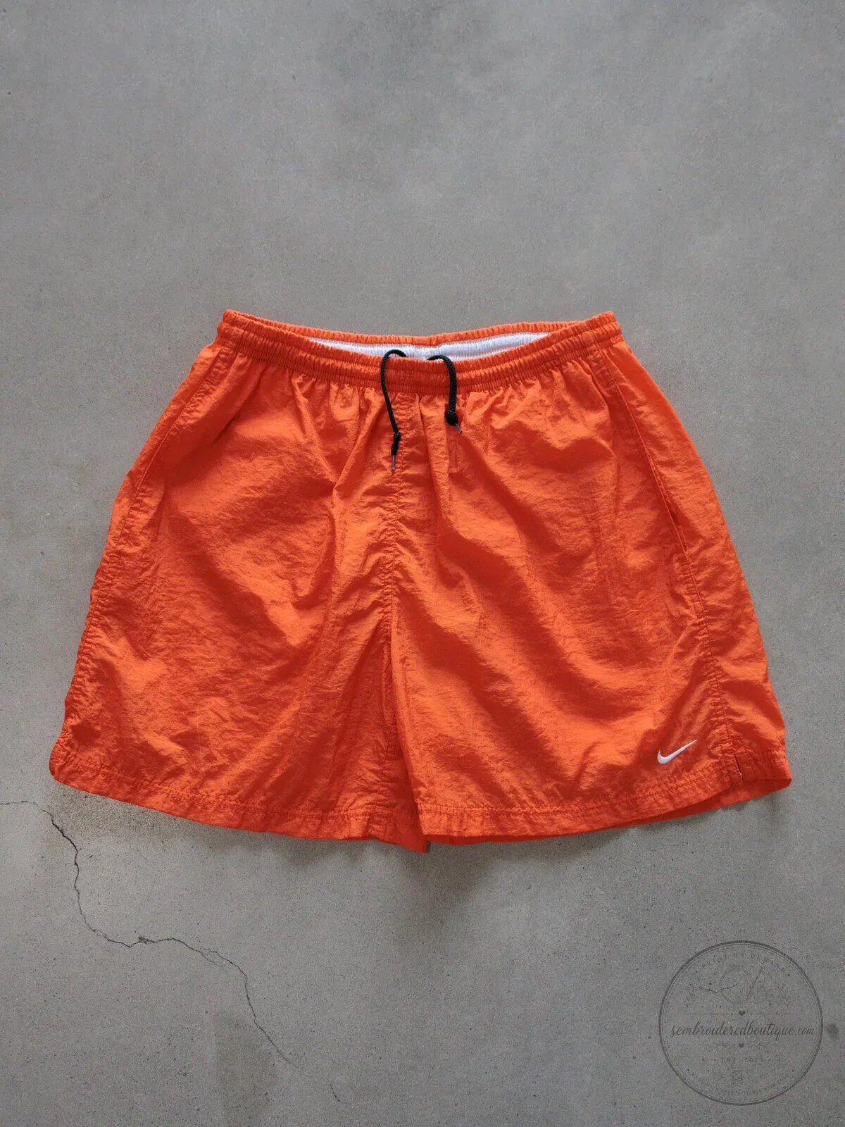 Vintage Nike Orange Swim Shorts for Women with White Swoosh Logo
